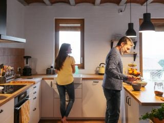 Adult Couple Cooking In The Kitchen.